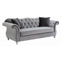 Eye-catching glam sofa collectionElegant rolled arms accented with individually placed chrome nailheadsInside arms and soft camel backrest beautifully tufted and adorned with sparkling crystalsQueen Anne legs in a chrome finish accentuate a graceful, curv