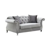 Eye-catching glam sofa collectionElegant rolled arms accented with individually placed chrome nailheadsInside arms and soft camel backrest beautifully tufted and adorned with sparkling crystalsQueen Anne legs in a chrome finish accentuate a graceful, curv