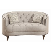 A modern spin on a classic traditional living room collectionSoft, grey linen-like upholsteryButton tufted seat and backrestNailhead trim traces graceful, C-shaped frame on sofa and loveseatBeautiful detailed solid wood legs create the perfect foundationT