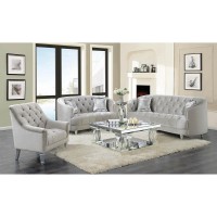 A modern spin on a classic traditional living room collectionGraceful, C-shaped silhouetteSoft, grey velvet upholstery with deep rhinestone tuftingElegant chrome nailhead trimSolid, turned wood legs in a silver finishThis collection is also available in t