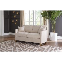 Arched arms, lustrous accents, and elegant tones give this sofa a combination of simplicity and splendorIncludes accent pillows for added style and plush comfortReversible down blend cushioned seats sinuous spring deck and webbed backStainless steel legs 