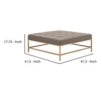 Benjara 42 Inch Metal Coffee Table With Tufted Top, Brass And Gray