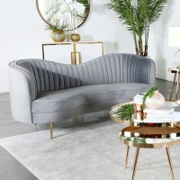 Sculptural modern glam in a luxurious grey velvetFeature an inverted camel back creating the right touch of curve appealTailored, vertical channels frame inside back providing a stylish back drop to the kidney shaped attached bench seatGold stainless stee