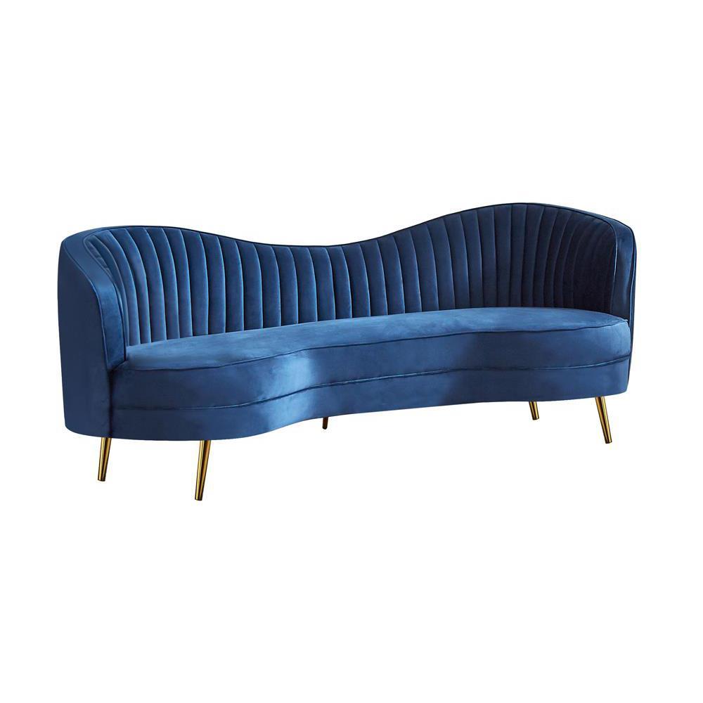 Sculptural modern glam in a beautiful shade of blue velvetSofa features an inverted camel back creating the right touch of curve appealTailored, vertical channels frame inside back providing a stylish back drop to the kidney shaped attached bench seatGold