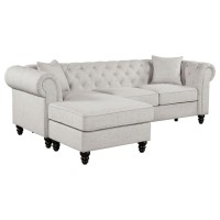 Versatile two-piece sectional with reversible chaise, ideal for a smaller room settingEasily change seating configuration by sliding ottoman base left or right, then flip to reverse chaise seat cushion to match arm cut outWide roll arms frame button tufte